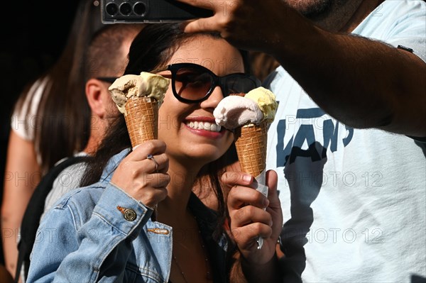 Couple taking a selfie of their ice cream from Gelateria Dondoli