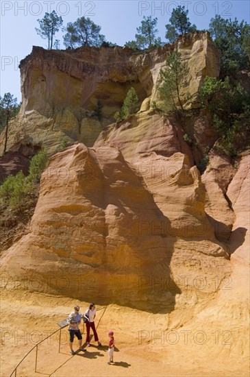 Tourists visiting the old ochre quarry at Roussillon