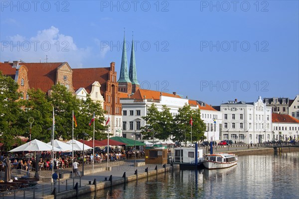 Historic houses and restaurants along the river Obertrave at the Hanseatic town Luebeck