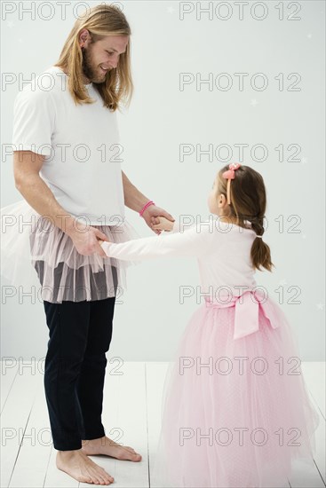 Side view father daughter tutu skirts