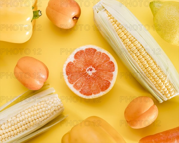 Top view grapefruit with corn peaches