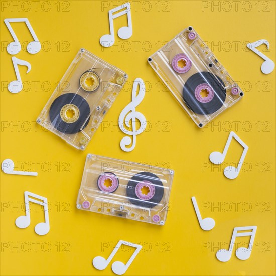 Transparent cassette tapes collection with musical notes around