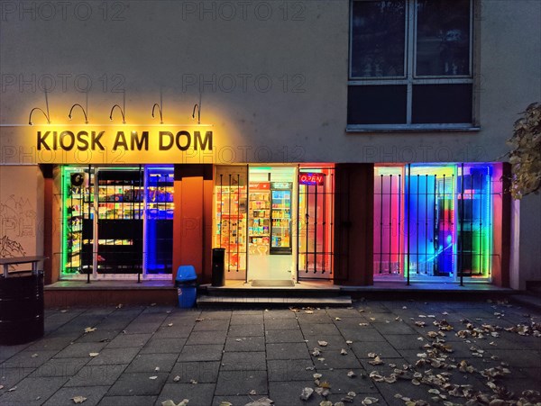 Brightly coloured illuminated kiosk at the cathedral