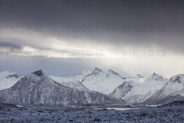 Lake and snow covered mountains in winter