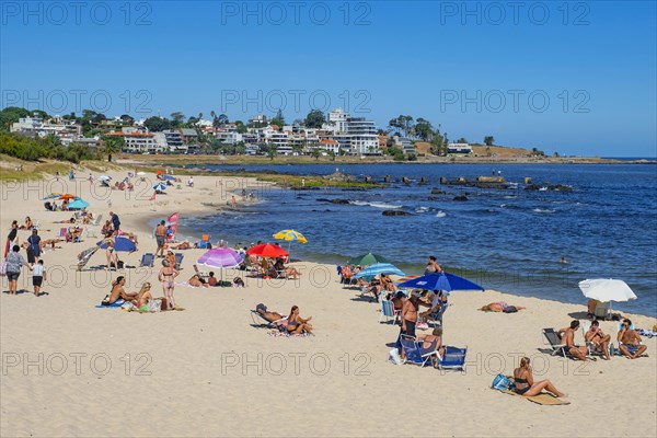 Tourists sunbathing on the Playa Honda beach