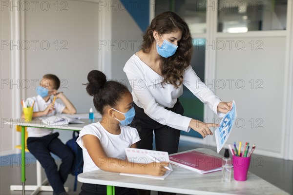 Woman showing pandemic prevention kid