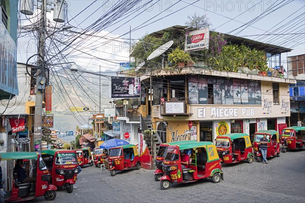 Red coloured tuk-tuks