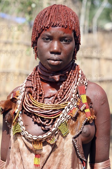 Close up portrait of woman of the Hamar tribe in traditional dress