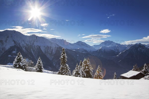 Swiss wooden chalet in the snow in winter in the Alps