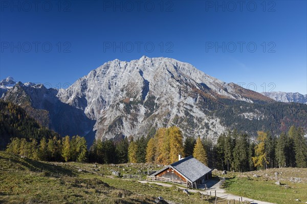 Mount Watzmann and wooden hut at Priesbergalm in the Berchtesgaden National Park