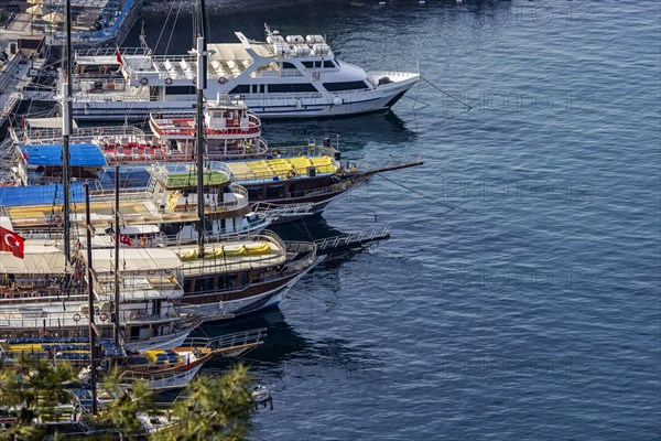 Excursion boats moored on the causeway to Pigeon Island in the bay of Kusadasi