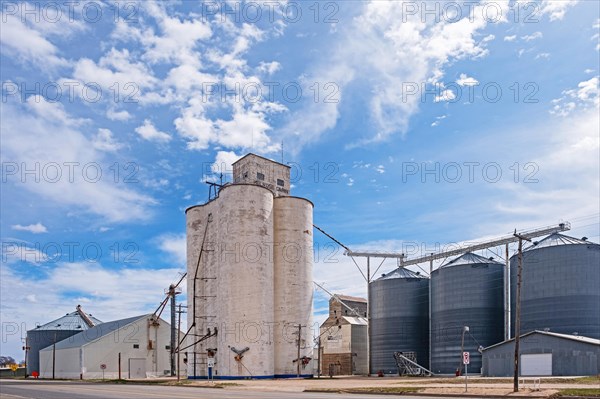 Silos connected to a grain elevator on a farm near the village Melrose in Curry County