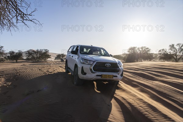 Off-road vehicle in the dunes of Sossusvlei