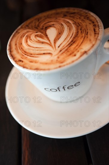 Cup of coffee with heart of milk foam