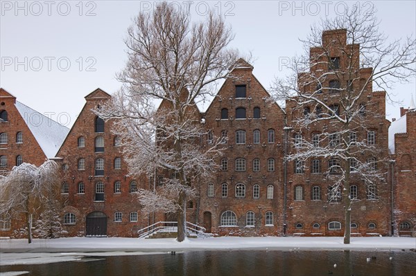 Historic salt warehouses in the snow in winter