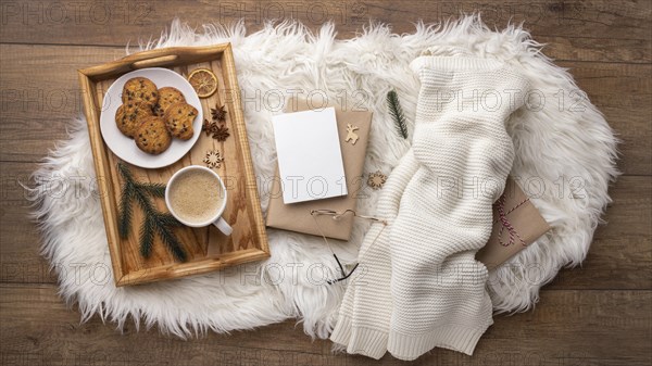 Top view tray with cookies coffee sweater