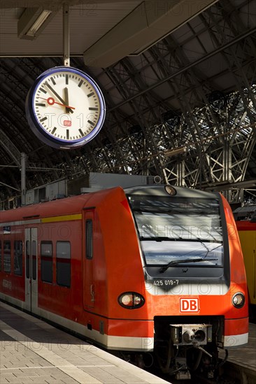 Local train at Frankfurt Central Station with station clock