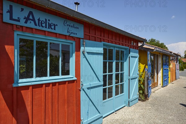 Studios in colourful former fishermen's huts in Le Chateau-d'Oleron