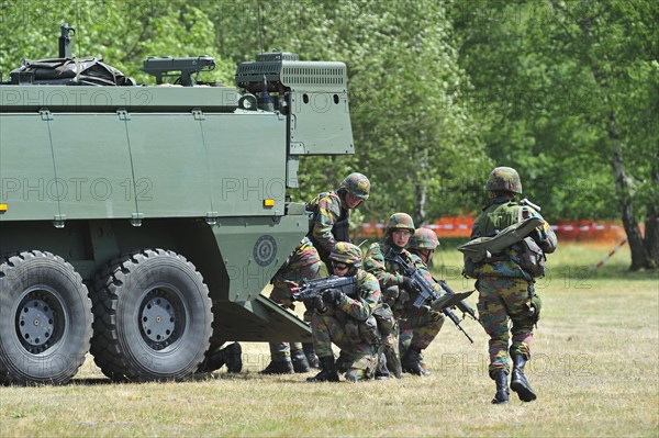 Demonstration of infantry soldiers fighting near MOWAG Piranha IIIC armoured fighting vehicle during open day of the Belgian army at Leopoldsburg