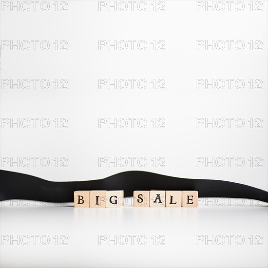 Big sale inscription wooden blocks with ribbon
