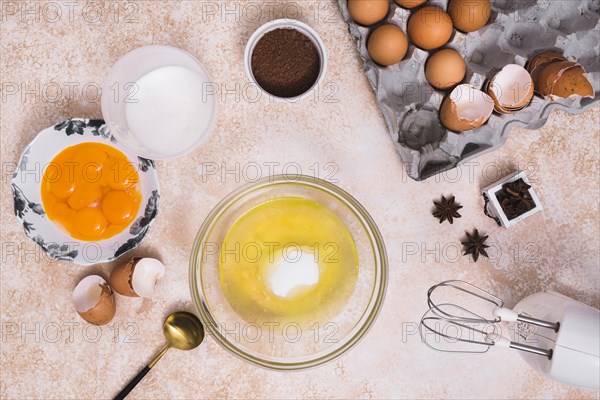 Various type ingredients making baked cake textured backdrop