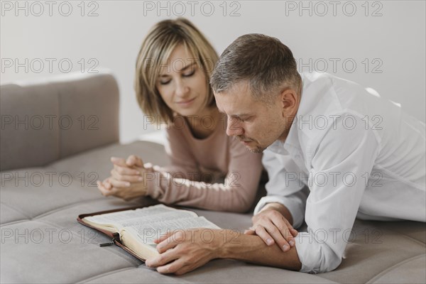 Wife husband studying holy book