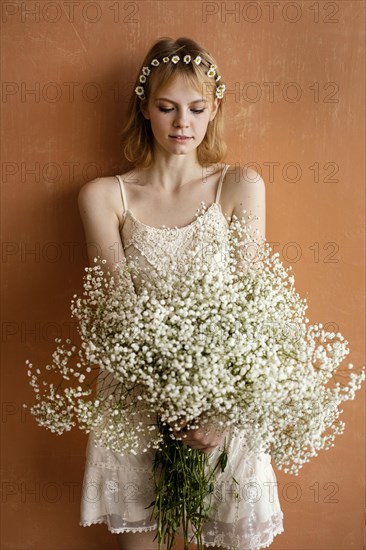 Woman posing with bouquet beautiful flowers