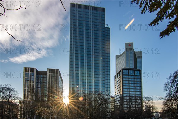 Sunset between skyscrapers. Cityscape with modern office buildings and streets. Insurance companies and banks as a cityscape in Frankfurt am Main