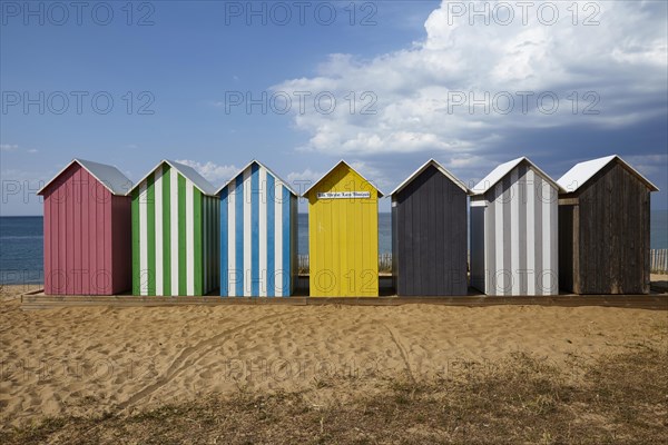 Colourful bathing houses on the beach at La Bree-les-Bains