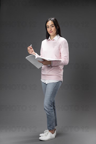 Portrait teacher female holding book_3