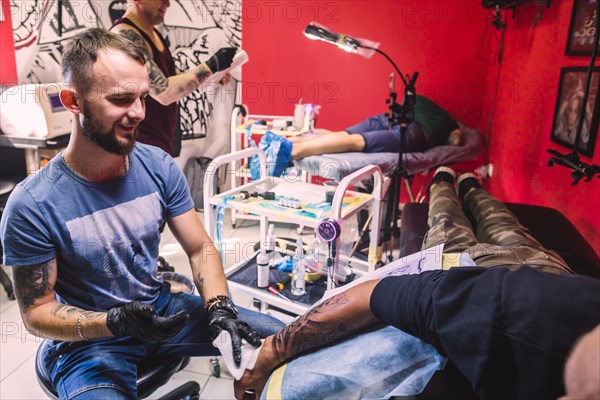 Tattoo studio with masters clients