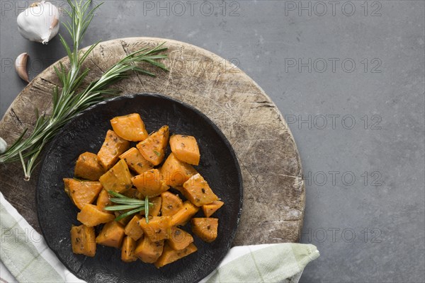 Top view sweet potatoes black plate