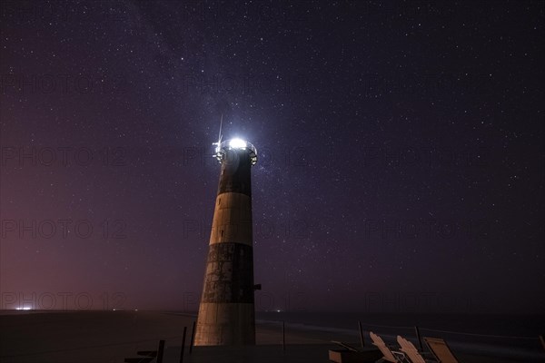 Pelican Point lighthouse with starry sky