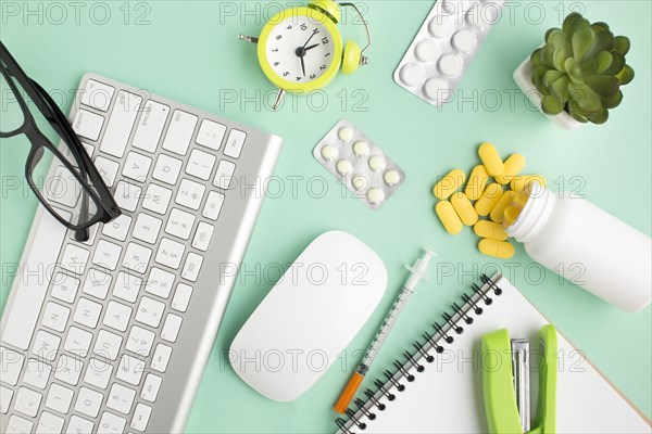 Medicines stationery wireless devices alarm clock green background