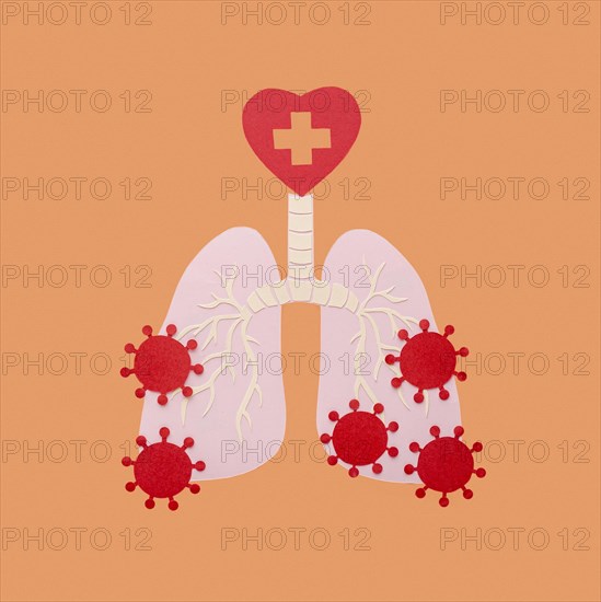 Paper made lungs isolated orange with viruses