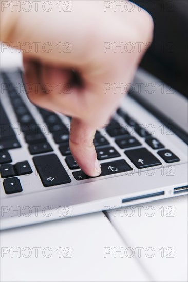 Person pressing enter key