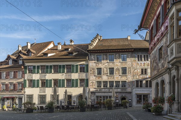 Medieval houses with facade paintings on the Rathausplatz in the old town centre