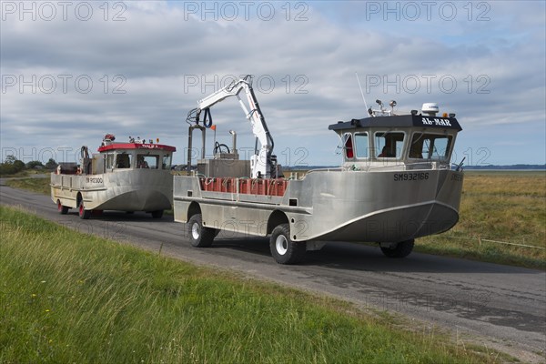 Amphibious vehicles on the road on the way to the mussel harvest