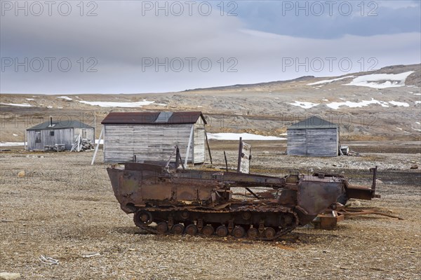 Rusty amphibian vehicle at deserted 1950s Kinnvika Arctic research station