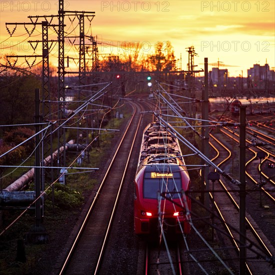 Elevated view of a local train at sunset