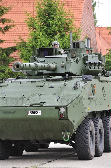 Commander in turret of MOWAG Piranha IIIC armoured fighting vehicle of the Belgian army