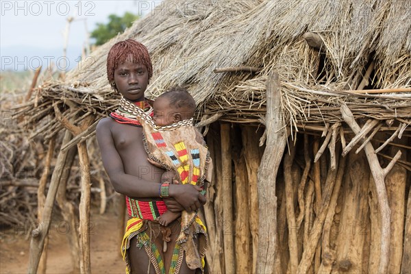 Young black girl with baby of the Hamar