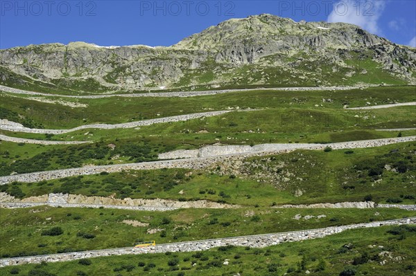 Road with hairpin curves winding over the Grimsel Pass in the Swiss Alps