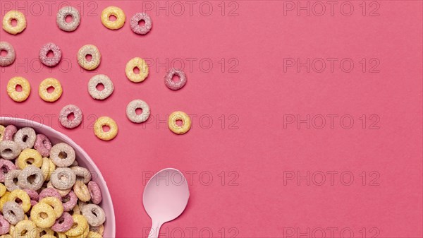 Bowl cereal fruit loops with spoon copy space