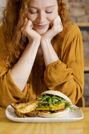 Close up smiley woman with food