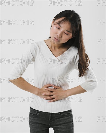 Front view woman having stomachache