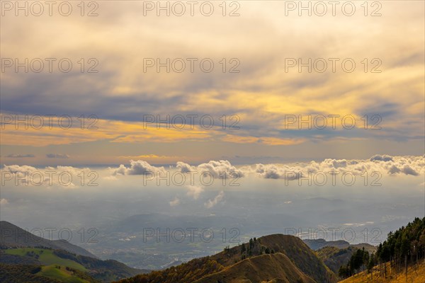 Aerial View over Beautiful Mountainscape with Floating Clouds with Sunlight From Monte Generoso