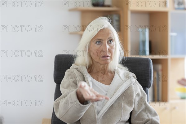 Therapist sitting in conversation in a practice