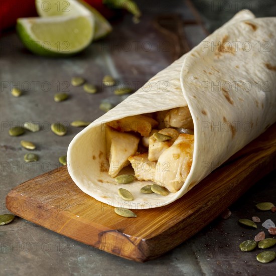 Burrito cutting board near cardamom seeds