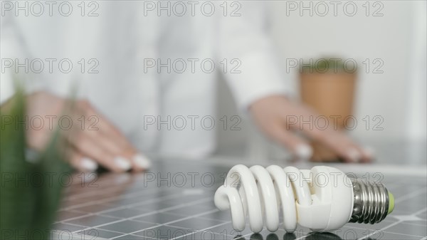 Close up blurry hands lightbulb